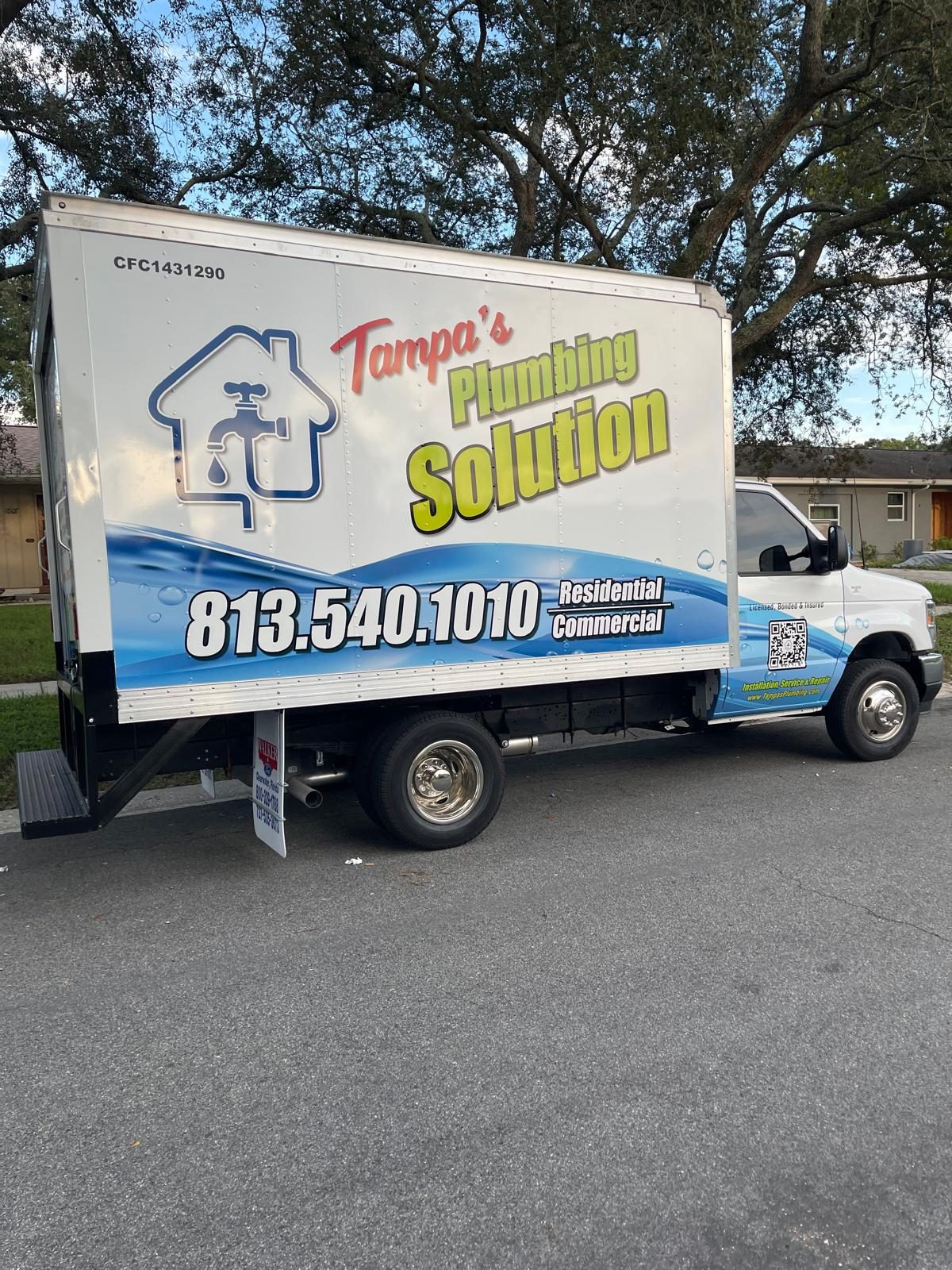 Tampa's Plumbing Solution work truck with phone number